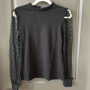 Black top with sheer polka dot sleeves size medium